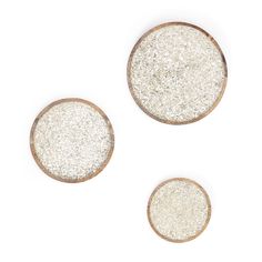 three white and silver glittered buttons on a white background