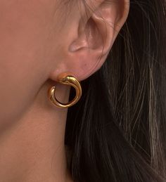 The Blair Earrings are the quintessential "quiet luxury" piece. Simple enough for everyday but elegant enough to wear to an event, these will be a staple in your collection for years to come. 18K gold plating on stainless steel Open, circular design Water resistant, hypoallergenic Gold Stainless Steel Anniversary Earrings, Elegant Open Circle Hoop Earrings Gift, Elegant Single Open Circle Earring, Trendy Round Hoop Earrings, Trendy Round Hoop Earrings With Plating, Gold Round Stainless Steel Earrings, Classic Hypoallergenic Circle Earrings, Classic Hypoallergenic Circular Earrings, Classic Plated Hoop Earrings