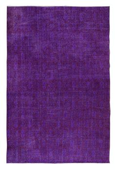 a purple area rug on a white background with no one in the photo or description