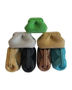 four different colored bags with handles on top of each other, one in the shape of an umbrella