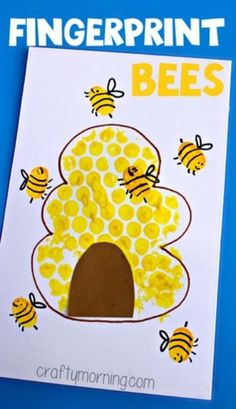 the fingerprint bee craft is made with construction paper and bees are on top of it