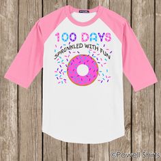 a pink and white shirt with a donut on it that says 100 days sprinkled with fun