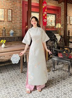 🌿 This set includes traditional Ao Dai, No pants. Style: Traditional Material: Very well made with high-quality silk Collar: traditional collar Please provide bust-waist-and hip measurements when placing your order to ensure the best fit for you. 🌿 NOTE: * Recommend gentle washing * Please contact us for any inquiries about size. We don't have an exchange policy for the wrong size * It is safe for a washer and dryer in a "delicate" setting. * Actual Ao Dai colors may differ up to 10% due to lightning and viewing devices. * These ao dai pants are made based on Vietnamese size; they will run smaller than American size. *3D printed ao dai: you may see some white broken fabric around the seam (collar). *There might be some chalk/ pen writings on the fabric because it is brand new, unwashed a Traditional White Cheongsam With Stand Collar, Festive Traditional Cheongsam With Short Sleeves, Traditional White Ao Dai For Festive Occasions, Festive Traditional Short Sleeve Cheongsam, Traditional Ceremonial Sets For Spring, Traditional Cheongsam For Spring Festivals, Traditional Spring Festival Cheongsam, Spring Festival Traditional Cheongsam, Traditional Festive Spring Cheongsam