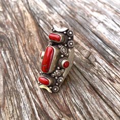 Red corals set on sterling silver traditional Tibetan saddle ring  Size ; this ring is adjustable fits sizes 9 to 10 Hight 46mm  X W24mm Red Inlay Ring Jewelry, Red Inlay Ring, Red Ring With Inlay, Traditional Red Ruby Ring, Red Sterling Silver Ring With Inlay, Red Sterling Silver Rings With Inlay, Adjustable Stamped 925 Red Jewelry, Traditional Red Ceremonial Rings, Traditional Adjustable Turquoise Ring