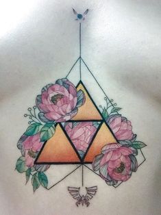 a woman's chest with flowers on it and a triangle in the middle,