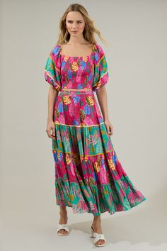 Ready for your next summer vacay? You will need the Marina Tropical Tiered Maxi Skirt! It has colorful tiered layers of this stunning floral print. It has a high waist style and invisible zipper on the side. Add on the matching cropped top to complete the look! - Tiered- Lined- Zipper- Maxi- Color: Fuchsia MultiSize + Fit - Model is 5'8" and wearing size XS- Measurements taken from size S - Waist: 13 1/4"- Length: 37" Fabric Self: 100% Viscose, Contrast: 100% Viscose, Lining: 97% Polyester 3% Sp Ruffle Maxi Skirt, Flowy Maxi Skirts, Tiered Midi Skirt, Balloon Sleeve Top, Tiered Maxi Skirt, Vacation Vibes, Color Fuchsia, Cold Drink, Layered Skirt