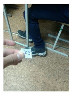 a person sitting on a chair with their foot up and the word twenty written on it