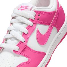 This Nike Dunk features a leather upper boasts a harmonious blend of white and laser fuchsia, with the striking shade accentuating the mudguard, eyestays, iconic Swoosh, and tongue tag. Meanwhile, the foundational elements are kept clean in white, which extends to the laces, tongue, sockliner, and heel. Completing the striking design is the white midsole and laser fuchsia rubber outsole. All Jordans, Nike Models, Cute Nike Shoes, Cute Nikes, Jordan 11 Retro, Vans Shop, Jeans For Short Women, Nike Kids, Kids Socks