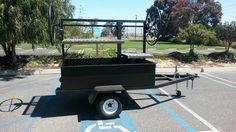 a small black cart parked in a parking lot