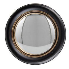 a black and gold framed mirror on a white wall