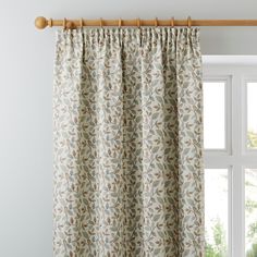 the curtain is hanging in front of a window