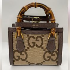 In Excellent Condition. Only Used A Few Times. Designer Beige Shoulder Bag With Bamboo Handle, Brown Gucci Crossbody Bag, Luxury Crossbody Bag With Bamboo Handle, Designer Beige Bag With Bamboo Handle, Gucci Brown Monogram Canvas Shoulder Bag, Brown Gucci Rectangular Bag, Luxury Shoulder Bag With Bamboo Handle, Gucci Brown Shoulder Bag With Top Carry Handle, Brown Gucci Shoulder Bag With Top Carry Handle