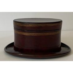 Vintage Maitland-Smith Box Hat Form Gold Embossed Tone and Imprint Embellished Cordovan Color Leather - from a Palm Beach estate.  This stylish, whimsical and chic storage box dates to the 1980s and was created by Maitland Smith.  The deep cordovan leather is highlighted with hand tooled, gilt gold edging. Formal Brown Hat, Formal Leather Card Holder With Embossed Logo, Formal Leather Box Bag With Gold-tone Hardware, Stamped Leather Vintage Cuff Bracelet, Embossed Leather Journal, Vintage Hand-tooled Leather Cuff Bracelet, Maitland Smith, Emboss, Storage Box