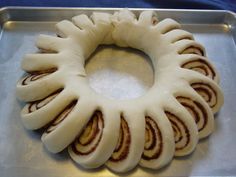 a bundt cake sitting on top of a pan covered in white frosted icing