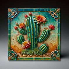 a decorative tile with cactus and flowers on the front, against a dark background that is lit up