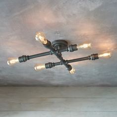 a ceiling light with five lights on it