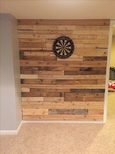 a wooden wall with a dart on it