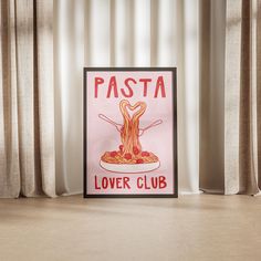 a poster with pasta on it sitting in front of a curtained window next to curtains