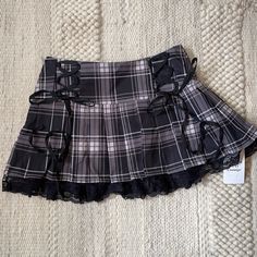 Cute Plaid Pleated Skirt. Zipper Side W/ Corsette Bows & Lace Edge. 14in Waist, 13in Length. Size M (Juniors) Nwt Tvd Style, Grunge Skirts, Layered Pleated Skirt, School Skirts, Riot Grrl, Pleated Skirt Pattern, Skirts Plaid, Y2k Inspo, Black Plaid Skirt