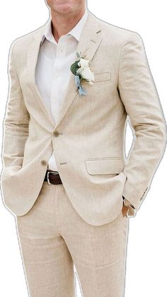 a man in a tan suit with a flower on his lapel and white shirt