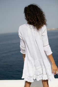 Imagine yourself twirling this dress in the streets of a gorgeous Mediterranean village! Made in Italy with unique, high-quality Italian linen, this dress is one of our signature pieces. It is a pleated dress with mid-length sleeves, buttoned on the front. A comfortable and timeless dress for your summer wardrobe. Summer Linen V-neck Dress For The Beach, White Linen Beach Dress Cover-up, Relaxed Fit Linen V-neck Dress For Beach, Breezy Linen V-neck Dress, White V-neck Linen Beach Dress, Mid Length Sleeves, Timeless Dress, Saint Tropez, Linen Dress