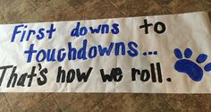 a sign that says, first downs to touchdowns that's how we roll