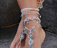 This listing is for one anklet. Beautiful macrame anklet. You can wear it alone or in combination with the barefoot sandals available in my shop (picture 2, 3 and 7) https://www.etsy.com/listing/509547430/silver-fairy-mandala-barefoot-sandals?ga_search_query=silver+fairy&ref=shop_items_search_2 This anklet is made with waxed polyester cord, tibetan silver beads and charms and czech seed beads. They close with a lobster claw and on the other side a small chain allows to adjust the length of t Bohemian Toe Ring For Festivals, Bohemian Style Toe Ring For Festivals, Bohemian Festival Toe Ring Jewelry, Handmade White Bohemian Barefoot Sandals, White Handmade Bohemian Barefoot Sandals, Bohemian Style Festival Toe Ring, White Bohemian Handmade Barefoot Sandals, Silver Beaded Anklets For Festival, White Anklets For Festivals And Gifts