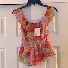 Adorable Pink/Orange Floral Peplum Off Shoulder Top! All Elastic Stretch With Ruffled Hemline! Top Is Fully Lined. Sweet Little Top For A Night Out! Brand Nwt. Peach Floral Print Summer Blouse, Feminine Multicolor Vacation Tops, Cute Pink Blouse For Spring, Cute Pink Spring Blouse, Cute Pink Blouse For The Beach, Cute Pink Blouse For Beach, Fitted Floral Print Peach Tops, Fitted Peach Floral Print Tops, Cute Summer Pink Blouse