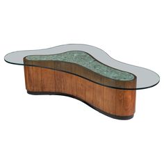 a wooden bench with glass top and curved legs