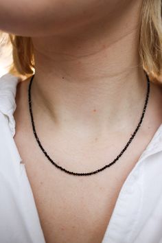 Drama calls and this Black Spinel necklace answers. Black Spinel is actually rarer than black diamonds and unlike black diamonds, is naturally this deep black color. Black is the rarest of the colors that occur in spinel family and is usually mined alongside rubies and sapphires. 17 inch length Metal/Materials: . Black Spinel beads, beading cable, gold crimps, gold French wire, gold-filled lobster clasp, crimp covers and jump rings. (sterling silver lobster clasp option) Black Spinel Necklace, Spinel Necklace, Black Diamonds, French Wire, Black Spinel, Deep Black, Strand Necklace, Jump Rings, Black Diamond