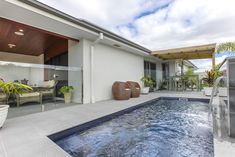 an indoor swimming pool in front of a house