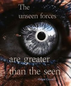 an eye with the words, the unseen forces are greater than the seen