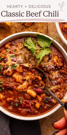 hearty and delicious classic beef chili recipe in a white bowl with a serving spoon