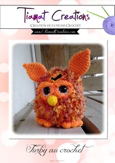 an orange crocheted owl with big eyes