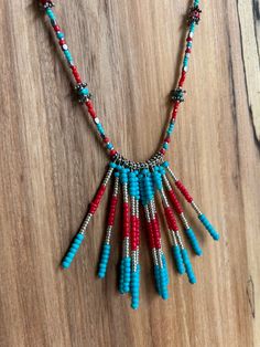 Turquoise and coral colored, beaded, turquoise choker Adjustable Turquoise Beaded Choker, Turquoise Hand-strung Beaded Necklaces, Unique Hand-strung Turquoise Beaded Necklace, Multicolor Turquoise Necklace With Hand-strung Beads, Unique Multicolor Hand-strung Turquoise Necklace, Turquoise Choker, Turquoise Bead Necklaces, Turquoise Glass, Native American Fashion