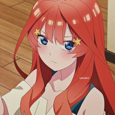 an anime character with long red hair and blue eyes