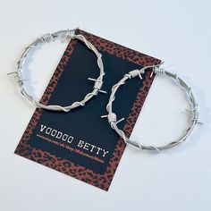 Handmade silver tone 4cm barbed wire hoop earrings. These are made with stainless steel hoops, and finished with aluminium jewellery wire. These are hypoallergenic. I offer these in gold tone, and in other sizes. Checkout my shop for more designs, and original vintage jewellery. https://www.etsy.com/your/shops/MidcenturyMissie Your order will arrived beautifully packaged in tissue paper, and sealed with a Midcentury Missy sticker. Trendy Metal Hoop Earrings For Streetwear, Silver Punk Hoop Earrings Gift, Silver Trendy Hoop Earrings For Streetwear, Edgy Metal Hoop Earrings Hypoallergenic, Metal Hoop Earrings For Streetwear, Edgy Metal Hypoallergenic Hoop Earrings, Silver Hoop Jewelry For Streetwear, Punk Style Metal Hypoallergenic Hoop Earrings, Silver Metal Punk Hoop Earrings