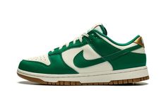 The Women’s Nike Dunk Low “Malachite” is a women’s-exclusive colorway of the classic basketball shoe with green details.  The “Malachite” Dunk Low is complete with a Sail leather base and Malachite leather overlays and Swoosh branding.  A classic “Nike” logo is embroidered on the Metallic Gold leather heel tab.  More “Nike” and Swoosh branding can be found on the tongue tag.  The Sail rubber midsole gives the shoe an aged look.  A gum rubber outsole finishes off the design.  Release date: Novemb Nike Dunk Low Malachite, Dunk Low Malachite, Low Dunks, Green Details, Sb Dunk Low, Stadium Goods, Sb Dunk, Nike Dunk Low, Dunk Low