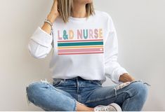 Labor and Delivery Nurse Sweatshirt L&D Nurse Sweater Baby - Etsy Golf Sweatshirt, Jesus Sweatshirts, Golf Sweater, Office Christmas Party, Custom Sweaters, Dunder Mifflin, Retro Sweatshirts, Taylor Swift Outfits, Nurse Sweatshirt