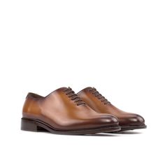 Often considered the most formal men's shoe available, the Wholecut features closed channel lacing and is made from a single cut of leather. The sleek design and limited stitching make for an elegant and highly sought-after style. The Details: Materials: cognac box calf Sole: cognac leather sole with rubber buttons injections Last: Zurigo - Rounded toe for traditional English Look What is Fast Lane? Fast lane is our new experimental 7 day made to order collection, an ambitious never been heard o Formal Oxfords With Stitched Sole In Calf Leather, Cognac Wingtip Dress Shoes For Office, Cognac Leather Shoes With Brogue Detailing For Semi-formal Occasions, Formal Cognac Plain Toe Loafers, Cognac Oxfords With Brogue Detailing And Almond Toe, Cognac Leather Cap Toe Shoes For Derby, Cognac Plain Toe Loafers For Formal Occasions, Elegant Cognac Monk Strap Shoes For Formal Occasions, Italian Made Brown Dress Shoes For Business