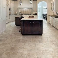 a large kitchen with an island in the middle