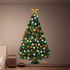 a decorated christmas tree with orange, white and black balls on it in a bedroom