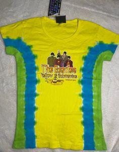 Vintage Liquid Blue Beatles Yellow Submarine tie dye t shirt with print on front. Baby doll style, Size SMALL. Collectible! New/old store inventory. Never worn, not preowned. Vintage but new and never worn! Casual Tie Dye Tops With Sublimation Print, Summer Fan Merchandise Printed T-shirt, Printed Fan Merchandise T-shirt For Summer, Fun Tie Dye Top With Graphic Print, Fitted Acid Wash T-shirt With Graphic Print, Casual Tie-dye Printed T-shirt, Casual Tie Dye Printed T-shirt, Casual Printed Tie Dye T-shirt, Tie-dye Band Merch Top With Graphic Print