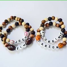 two bracelets with sports balls and words on them