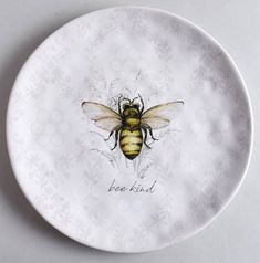 a plate with a bee painted on it