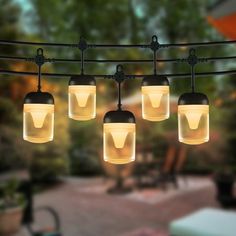 an outdoor string light with five lights hanging from it