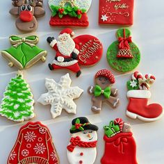 christmas cookies are arranged on a white surface