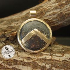 "This Spartan Shield necklace is hand sculpted, domed and beaten up to look like it has been on a battlefield. The letter lambda (Λ), standing for Laconia (administrative capital of Sparta) or Lacedaemon (ancient name for the city of Sparta), which was painted on the Spartans' shields, was first adopted in the 420s BC, and quickly became a widely known Spartan symbol. Military families passed on their shields to each generation as family heirlooms. - Hand sculpted pendant - Solid yellow bronze a Ancient Style Yellow Gold Brass Jewelry, Ancient Ceremonial Jewelry, Artisan Necklace With Round Pendant, Artisan Hand Cast Necklace With Round Pendant, Handmade Coin-shaped Amulet Jewelry, Gold Medallion Jewelry Hand Cast, Gold Medallion Hand Cast Jewelry, Ancient Brass Round Pendant Necklace, Artisan Hand Cast Pendant Jewelry