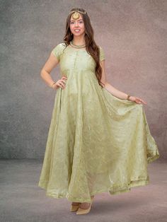 Step into a fairy tale with the Enchanting Anarkali Pastel Green Dress, elegantly crafted from organza and embellished with gold flower work. This full-length, flared dress is perfect for festive and formal occasions, offering a look of ethereal beauty. It is recommended that this item be dry cleaned for optimum preservation. Key Specifications : Material Organza Occasion Festive Type Anarkali Dress Eid Reception Dress With Gold Embroidery, Gold Anarkali Salwar Kameez In Organza, Gold Fitted Georgette Dress, Semi-stitched Gold Dress With Sheer Dupatta, Gold Semi-stitched Dress With Sheer Dupatta, Dress With Pallu For Eid Reception, Bollywood Style Dress With Gold Embroidery For Reception, Gold Georgette Dress With Sheer Dupatta, Gold Organza Anarkali Kurta