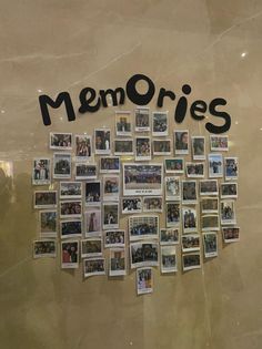 a bunch of pictures hanging on the side of a wall with words and photos attached to it